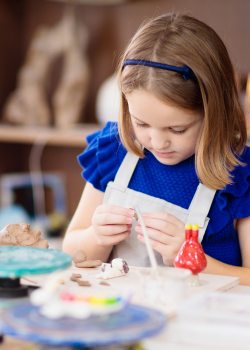 Child in Pottery Workshop